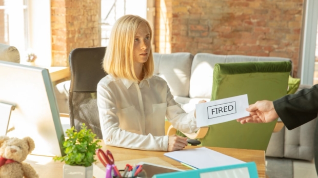Mastering Job Loss - Girl fired by her boss, handing over termination letter by her boss